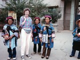 Travel buddy Jude, a Canadian house restorer from the Yukon, with local Yi people in Kunming, Southwest China's Yunnan province