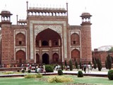 The Taj Mahal is an ivory-white marble mausoleum on the right bank of the river Yamuna in Agra, Uttar Pradesh, India. It was commissioned in 1631 by the fifth Mughal emperor, Shah Jahan to house the tomb of his beloved wife, Mumtaz Mahal; it also houses the tomb of Shah Jahan himself