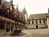 The Hospices de Beaune or Hôtel-Dieu de Beaune is a former charitable almshouse in Beaune, France. It was founded in 1443 by Nicolas Rolin, chancellor of Burgundy, as a hospital for the poor