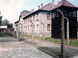 Auschwitz concentration camp (also known as Oświęcim concentration camp[3]) [a] was a complex of over 40 concentration and extermination camps operated by Nazi Germany in occupied Poland (in a portion annexed into Germany in 1939)[4] during World War II and the Holocaust.